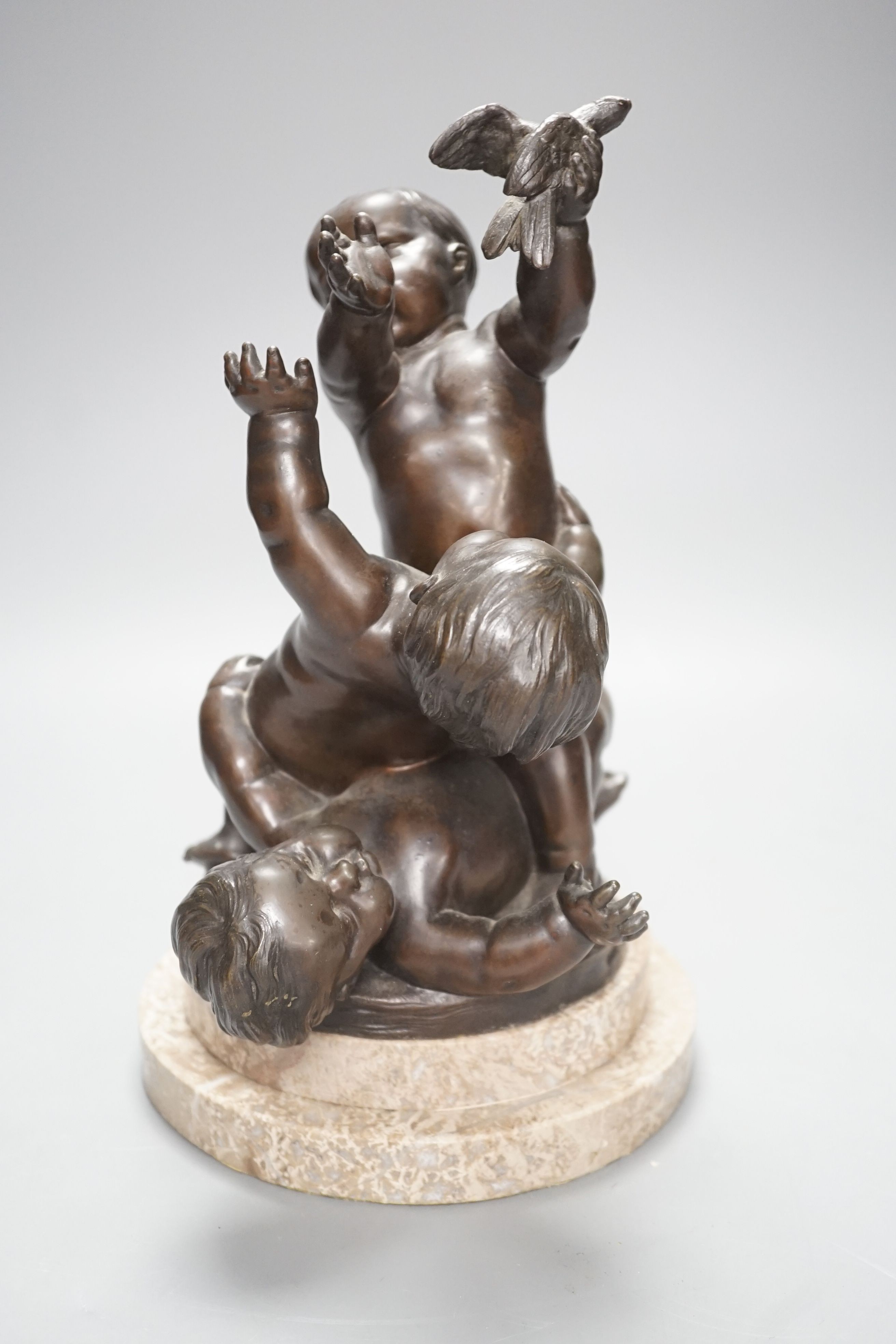 A bronze figure group of a trio of putto, height 28cm